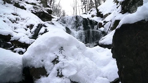 Waterfall in winter slow motion Stock Footage 99704381