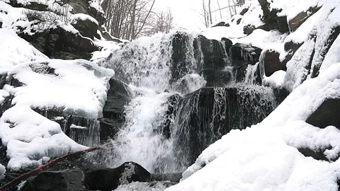 Waterfall in winter slow motion Stock Footage 100334392