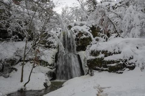 Waterfall in  Winter time. Stock Photos