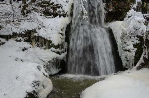 Waterfall in  Winter time. Stock Photos