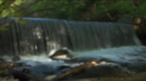 Waterfall in woods, rack-focus Stock Footage 311900