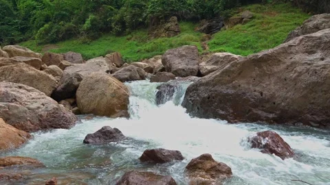 Waterfall1Waterfall flowing through rock layers into a pool, flowing into a rive Stock Footage 282518860