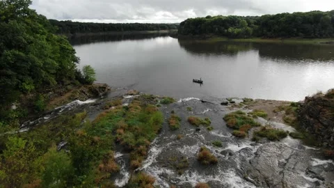 Waterfalling into lake Stock Footage 141705745