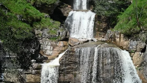Waterfalls cascade over rocks Stock Footage 219364213