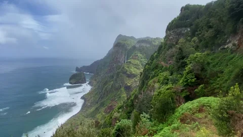 Waterfalls cascading down lush cliffs in Madeira Portugal Stock-Footage 339775850