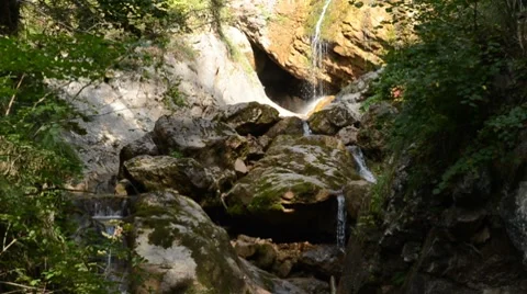 Waterfalls with cave Stock Footage 8622709