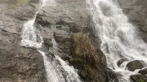 Waterfalls down a mountain side Stock Footage 195110911