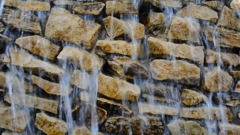 Waterfalls dripping and flowing down rock wall closeup. Video stock 89869421