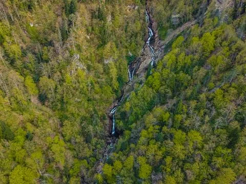 Waterfalls flow down from high altitudes. Stock Photos