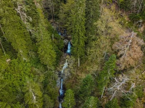 Waterfalls flow down from high altitudes. Stock Photos