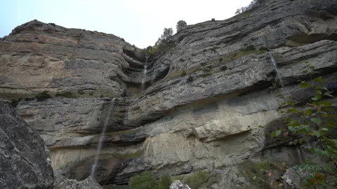 Waterfalls Flowing Down Rocky Cliffs Stock Footage 318836377