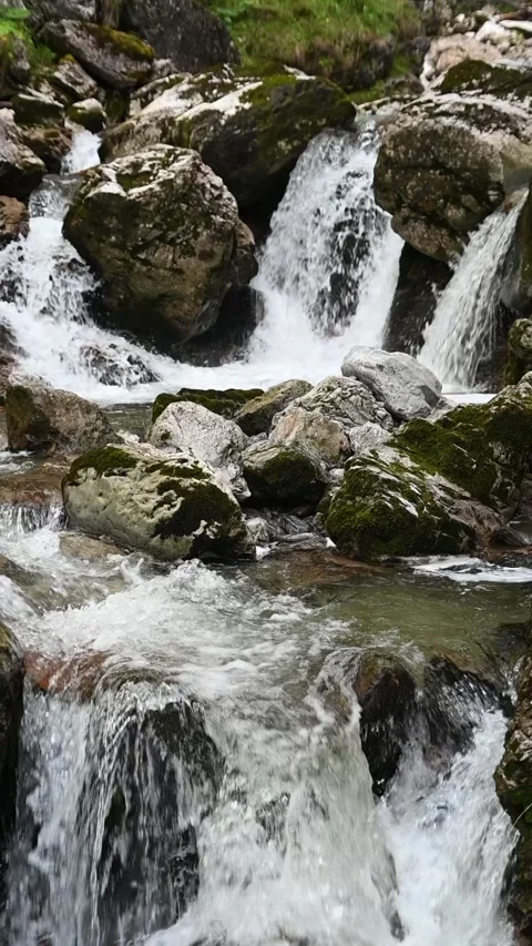 Waterfalls of a mountain stream, slow motion, vertical shot Stock-Footage 260871364