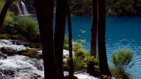 Waterfalls, river falling in crystal clear blue lake in Plitvice National Park Stock Footage 89158955