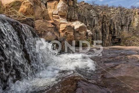 Waterfalls with rocks in the canyon of Leba. Angola. Lubango. Stock Photos
