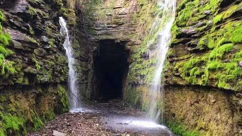 Waterfalls Running Next to a Cave Stock-Footage 100799407