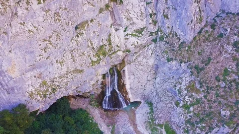 WaterfallWaterfall Gega - Flows From the Rock. Summer, Green Trees , Cascade Stock Footage 94742770