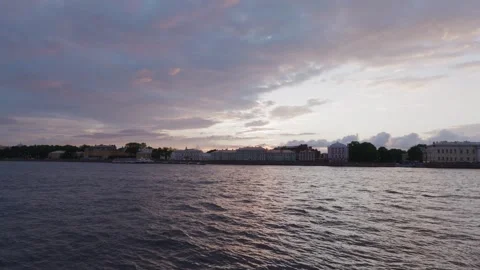 Waterfront cityscape at dusk over river with neoclassical buildings Stock Footage 345700332
