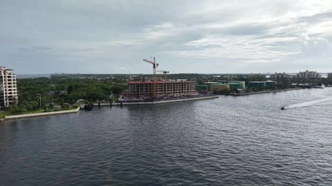 Waterfront Construction Site – Aerial Approach Over Canal in South Florida Stock Footage 312644285