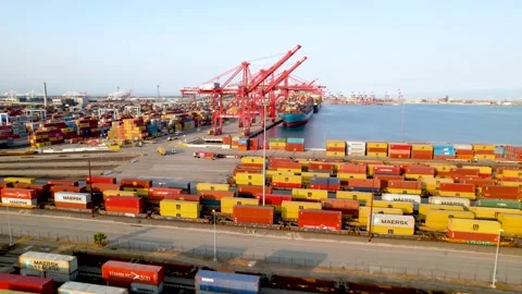 Waterfront to Container Yard and Red Port Cranes, Aerial Flyover, 4K Stock Footage 160313374