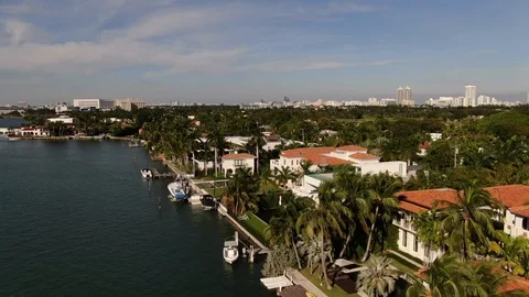 Waterfront estates with red tile roofs in Miami Beach, Florida Stock Footage 100078598