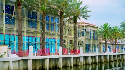 Waterfront mansions under construction with scaffolding shot in 8k Video stock 310014181