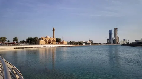 Waterfront Mosque reflecting on Jeddah Corniche at sunset, Saudi Arabia Stock Footage 308676031