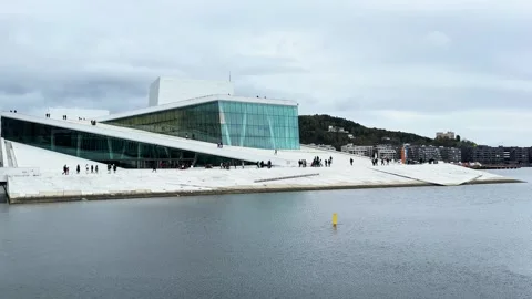 Waterfront oslo opera house sloping white marble roof angular glass facades Video stock 327635269