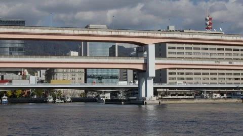 Waterfront skyline: Layered pattern of elevated highways in Kobe Japan Stock Footage 326027520