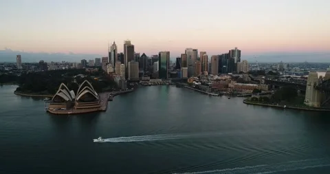 Waterfront of Sydney CBD around Circular quay across harbour at sunrise. Stock Footage 134607478