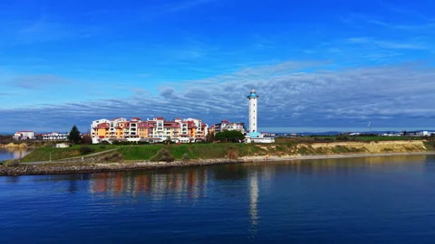 Waterfront view of Pomorie lighthouse and resort buildings, Bulgaria 스톡 동영상 339667540