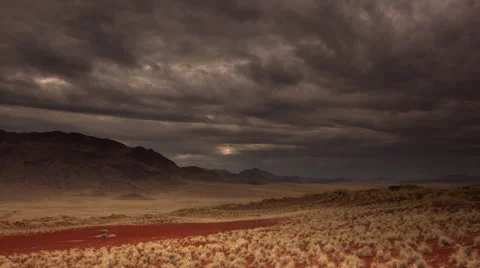 WATERHOLE SET IN RED EARTH AND GRASSLAND HD Stock Footage 45342531