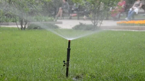 Watering of grass Vídeos de archivo 5257570
