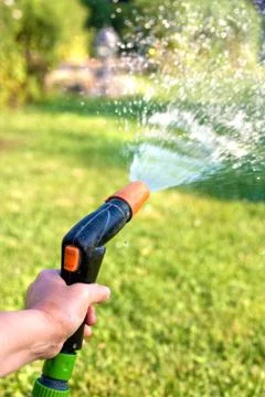 Watering the grass Stock Photos