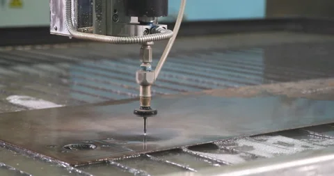 Waterjet high pressure CNC machine is cutting out a holes on a metal sheet. Video stock 178997941