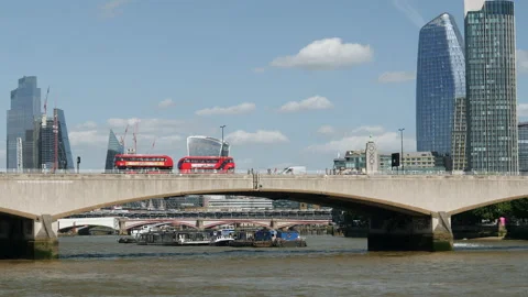 Waterloo Bridge with red buses and iconic towers in the background. London, UK. Stock Footage 208024961