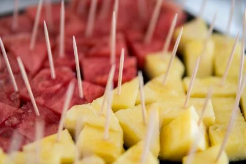 Watermelon and pineapple on a toothpick Stock Photos