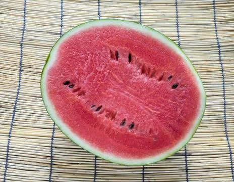 Watermelon on bamboo Stock Photos