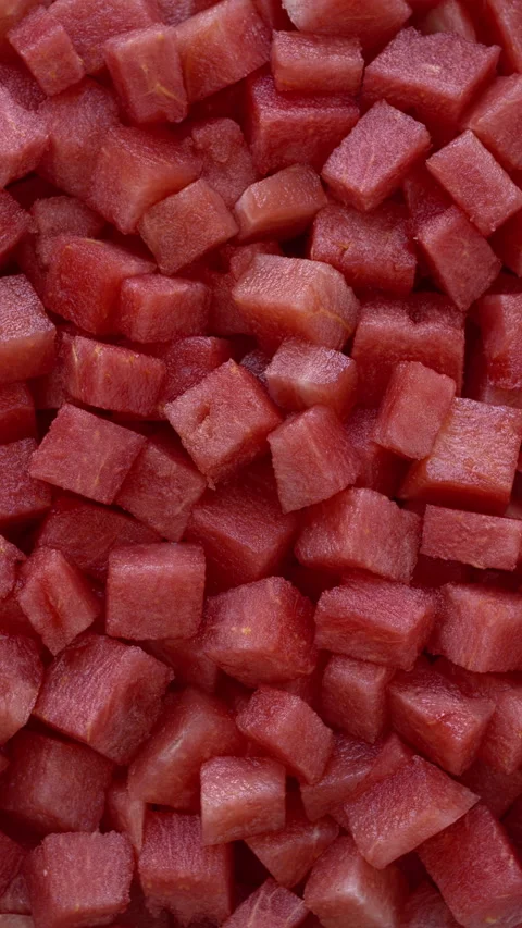 Watermelon chunks background. Flat lay. Vertical video. Stock Footage 311574353