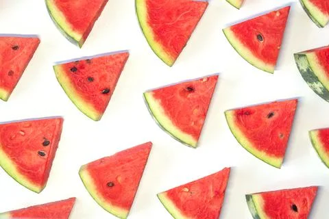 Watermelon chunks pattern on white background. Stock Photos