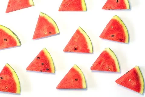 Watermelon chunks pattern on white background. Stock Photos