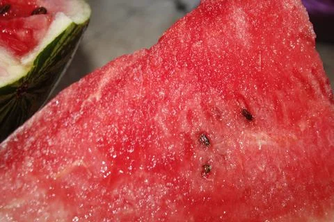 Watermelon cut in half close up, red watermelon with black seeds. Stock Photos