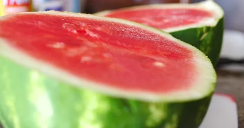 Watermelon cut in half close up spinning around it day Video stock 205329765