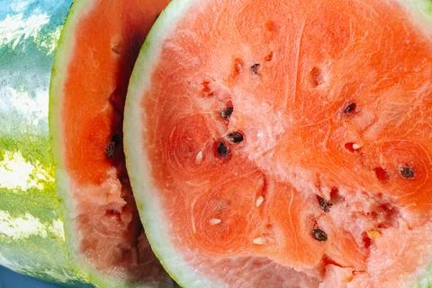 Watermelon cut in half is lying on the table. Fresh vitamins fruit. Stock Photos