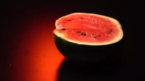 A watermelon cut in two halves with a knife Stock Footage 283731828