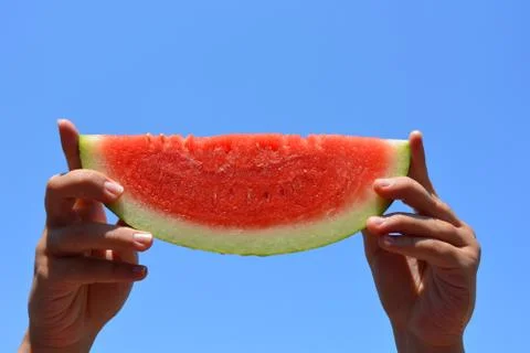 Watermelon in hands Stock Photos