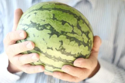 Watermelon held by a man Stock Photos