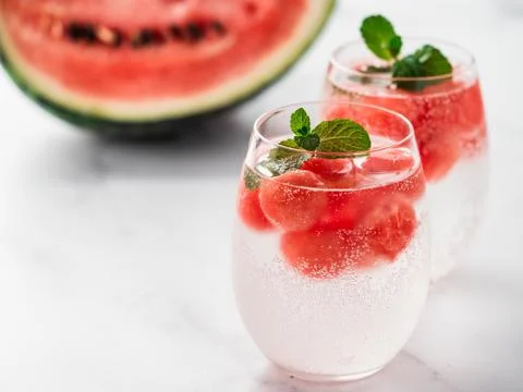 Watermelon ice with sparkling water in glasses Stock Photos