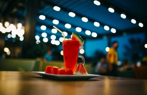 Watermelon juice on the table. bokeh background in cafe. wood table Stock Photos
