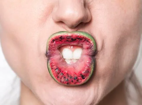 Watermelon lips making grimace Stock Photos