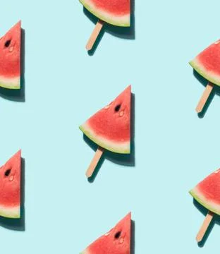 Watermelon popsicle on blue seamles pattern Stock Photos